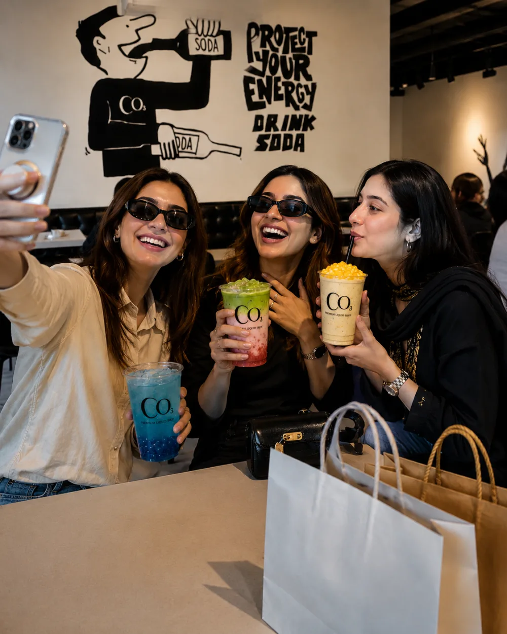 Friends enjoying drinks together at CO3